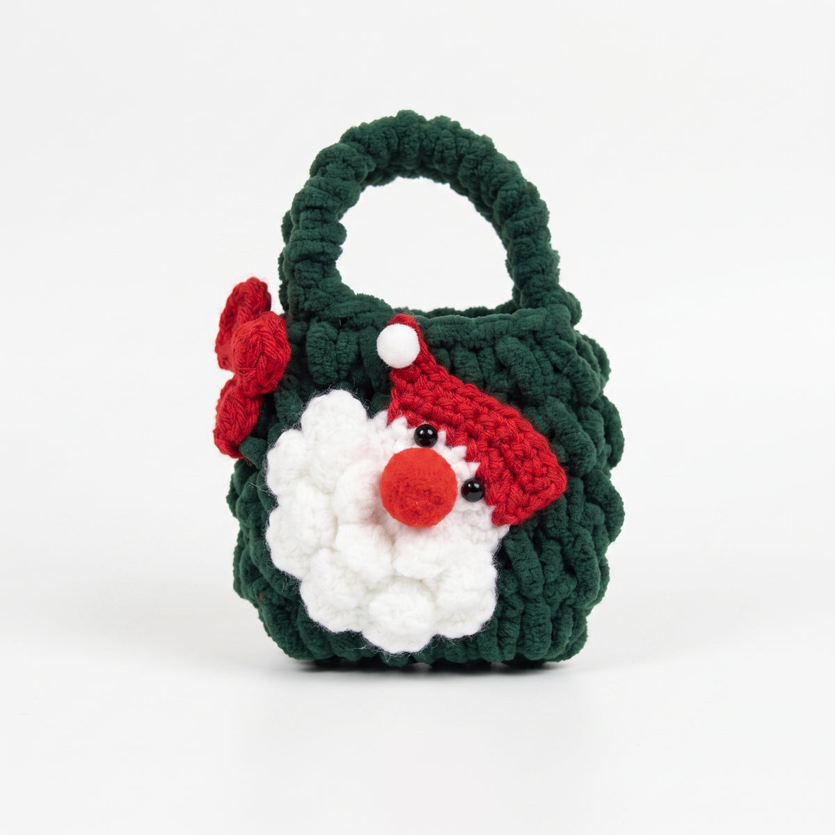 Dark green handmade crochet mini tote bag with cute crocheted Santa gnome face and red bow, small Christmas holiday gift bag