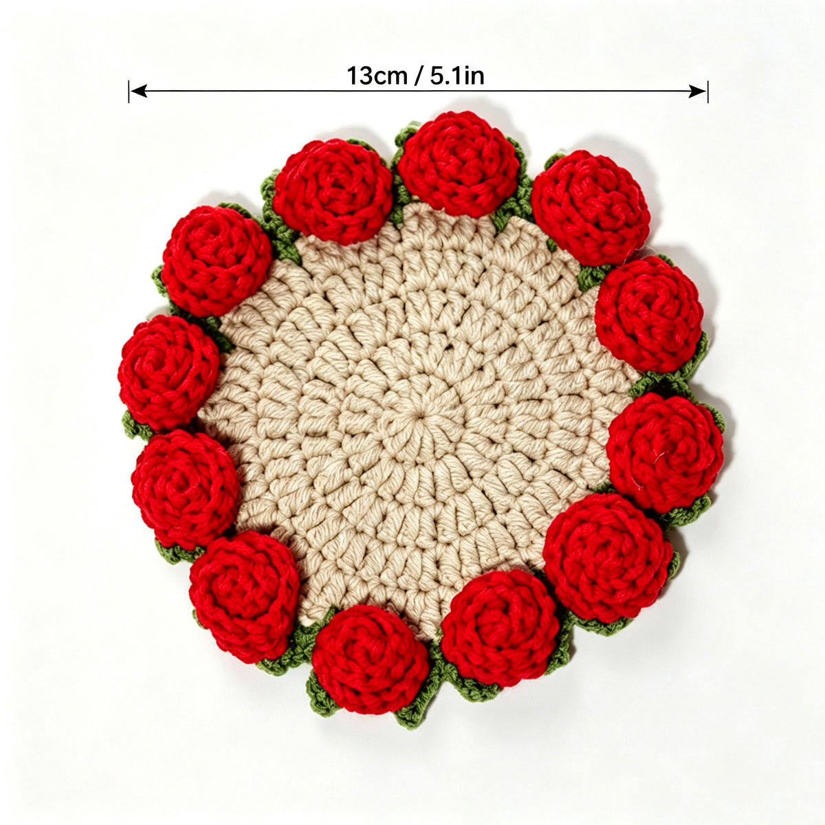 Handmade beige crochet coaster with red 3D roses and green leaves around edge, size marked 13cm 5.1 inches, top view on white background, floral drink mat